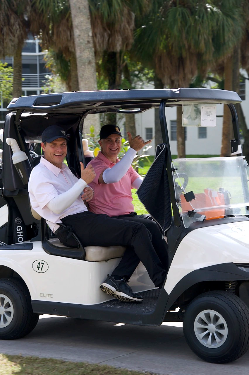 Two players in cart 47 heading to their hole