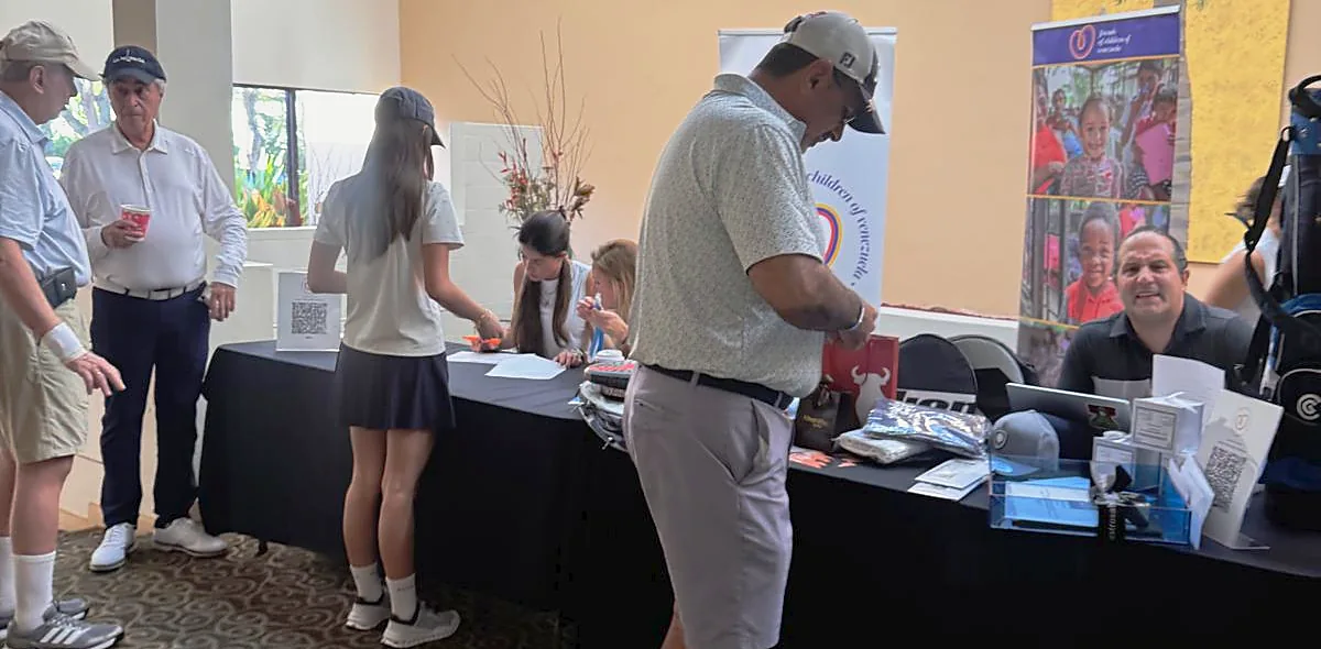 Players checking in at the registration table on tournament morning