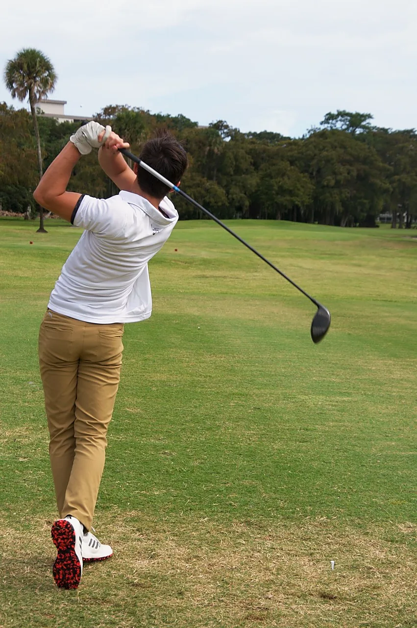 A player watching his drive after the follow-through