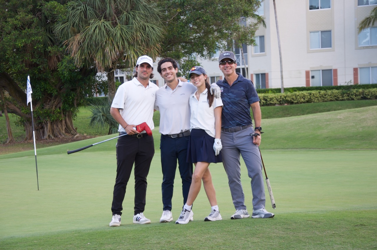 A foursome on the green after finishing their round