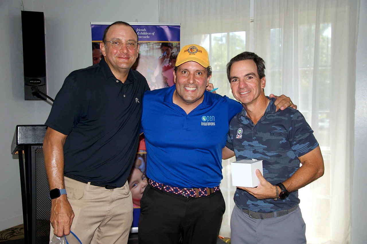 A prize winner with the organizers at the awards