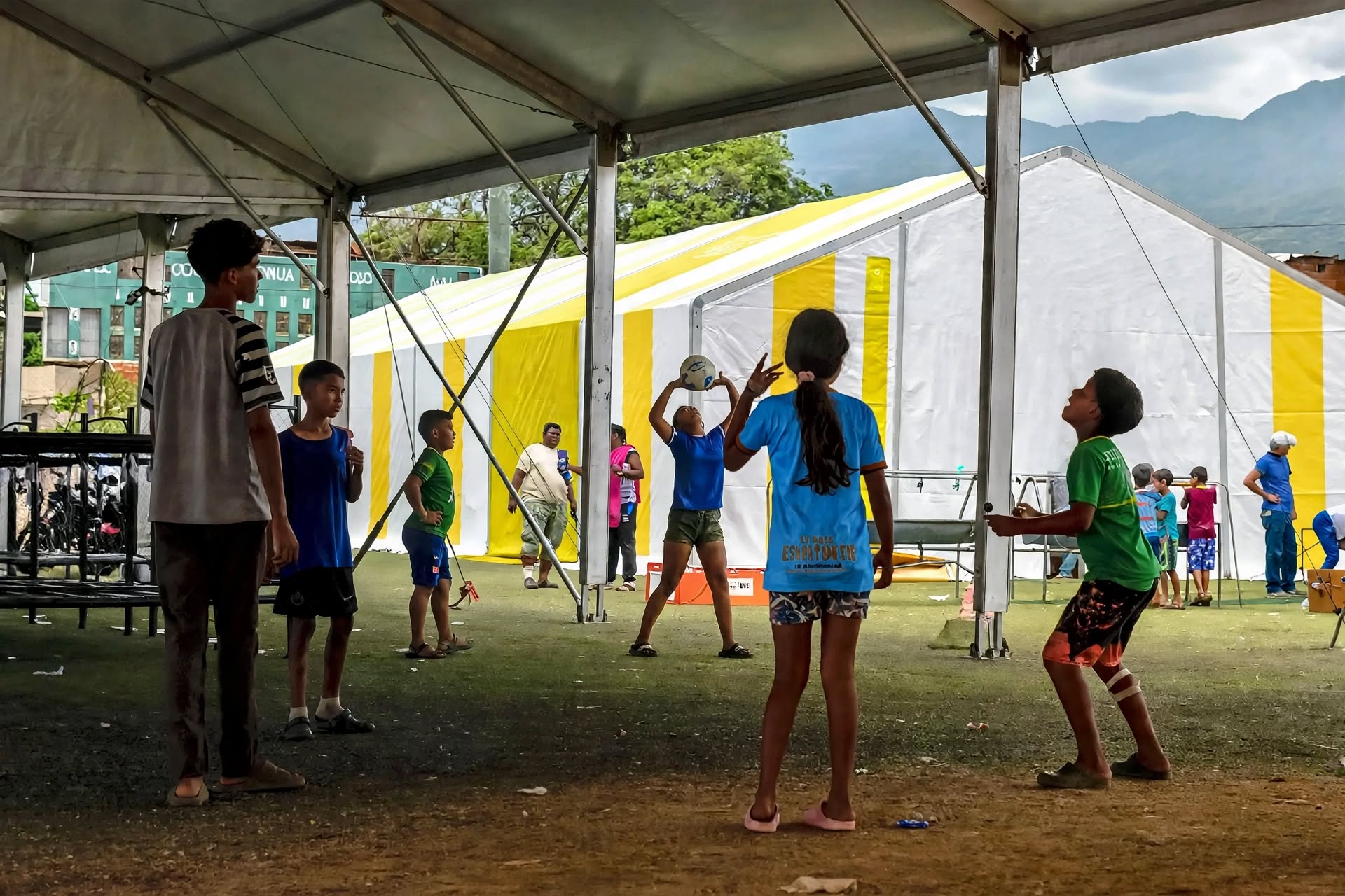 Children playing under relief tents in Venezuela after the 2026 earthquakes