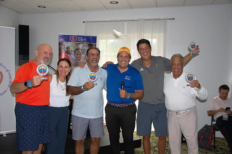 Winners receiving awards at the Swing for Children of Venezuela tournament